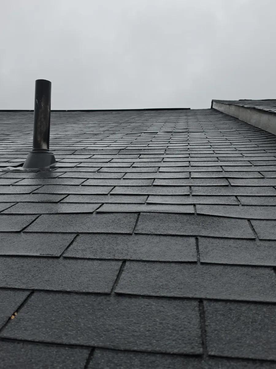 Old shingles and roof pipe before replacement in Brambleton, VA
