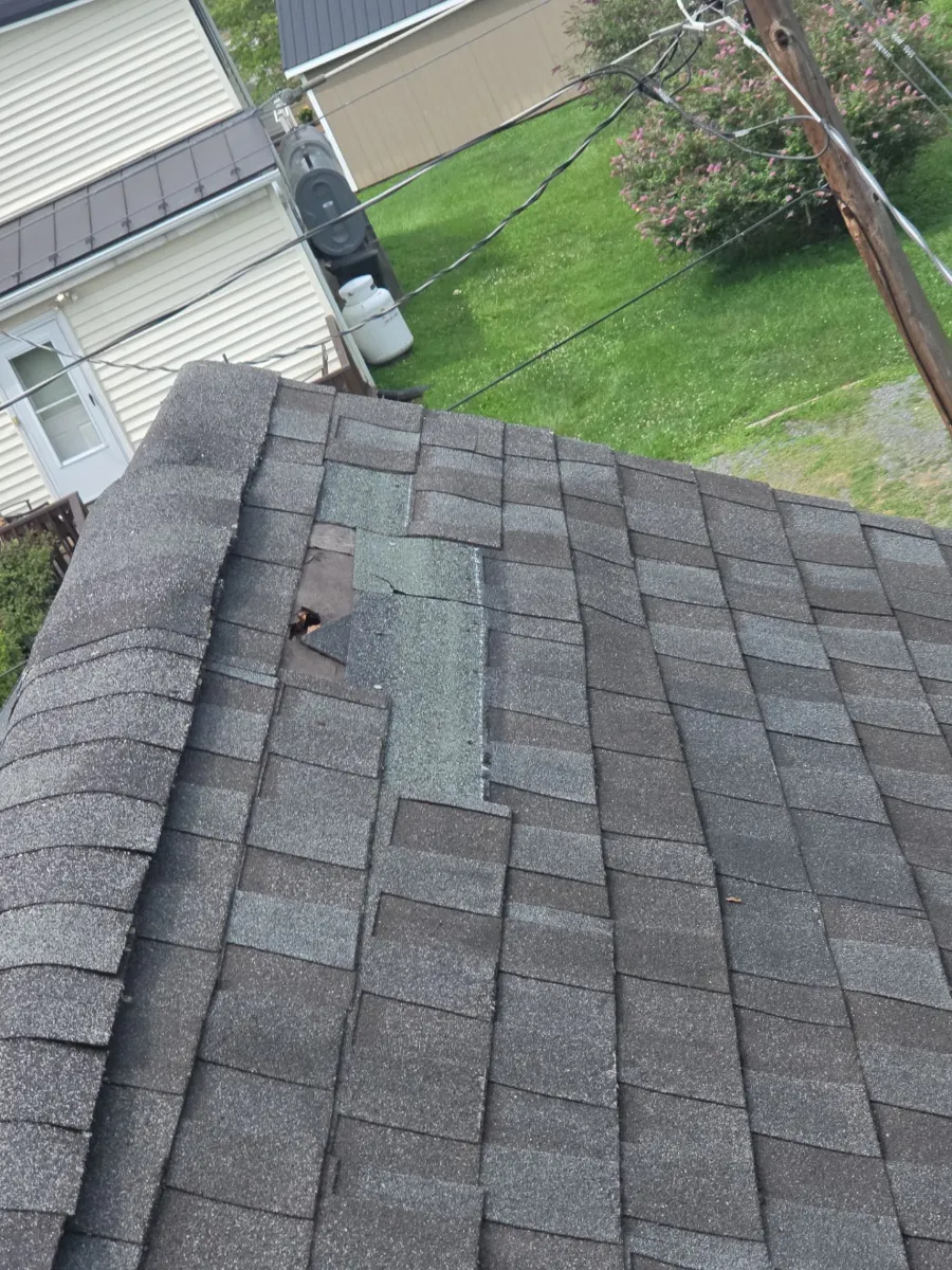 Existing roof edge and shingles before replacement in Hamilton, VA