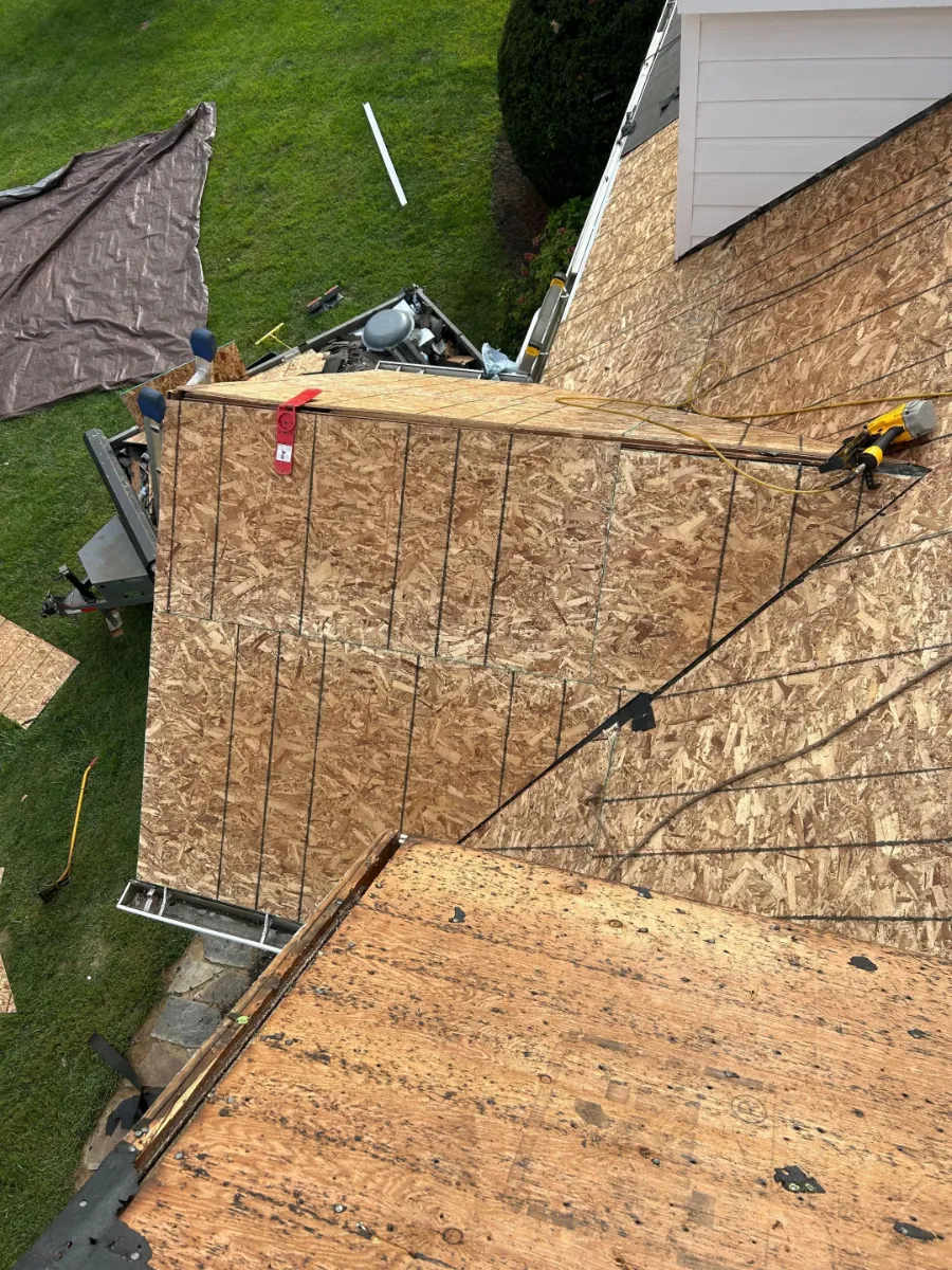Bare roof decking after old shingles were torn off in Hamilton, VA