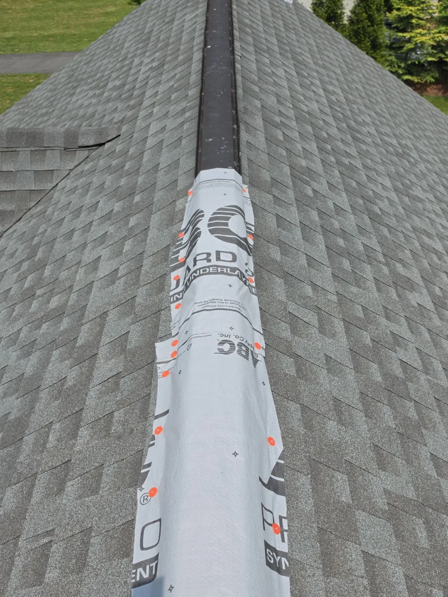 Roof ridge temporarily covered to stop leaks in Hamilton, VA
