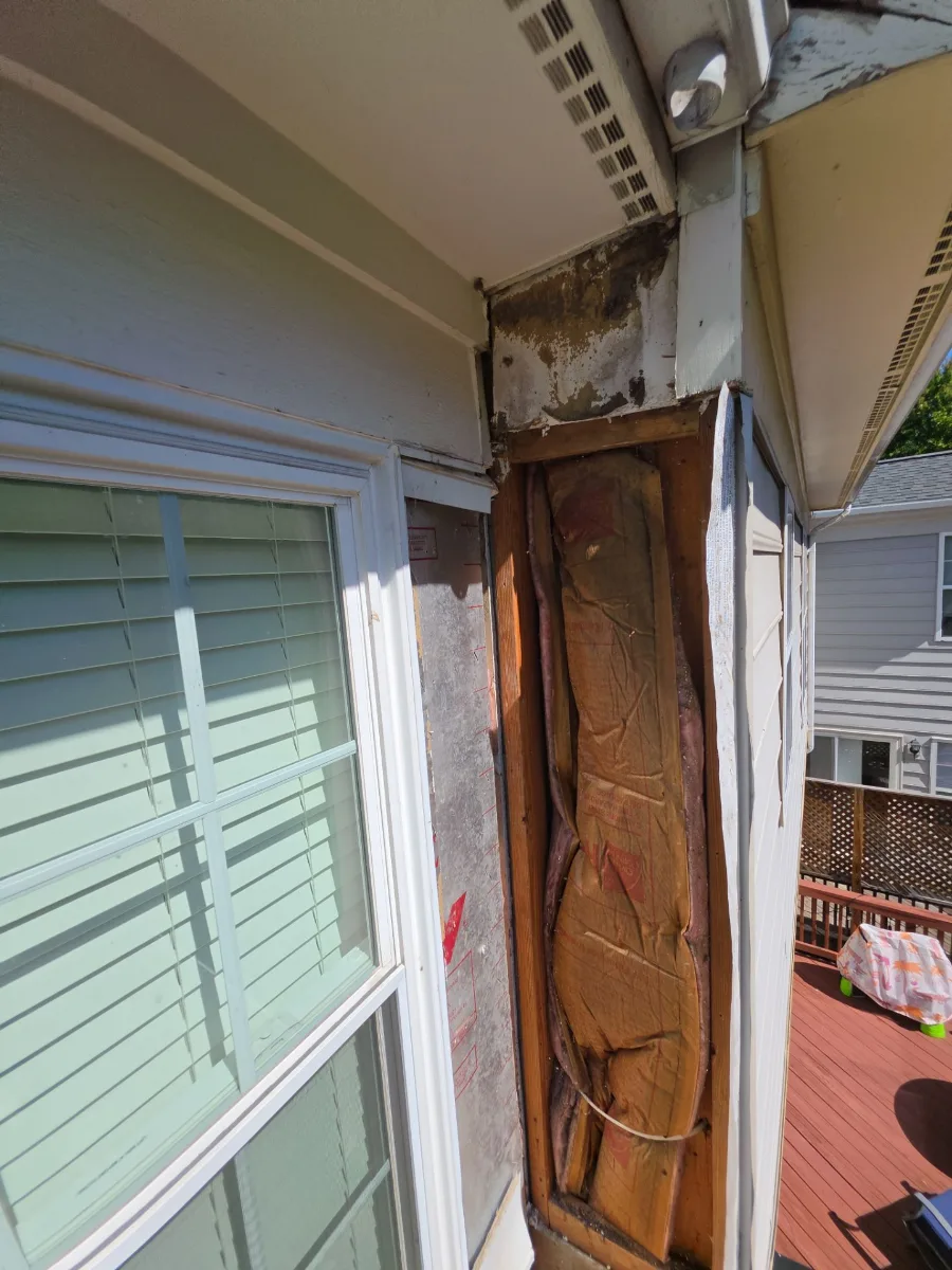Siding removed to show water-damaged wood behind it in Leesburg, VA