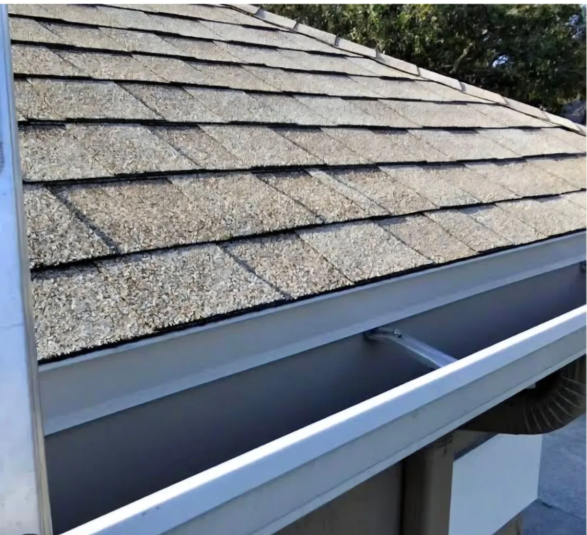 Worn shingles and roof edge before replacement in Leesburg, VA