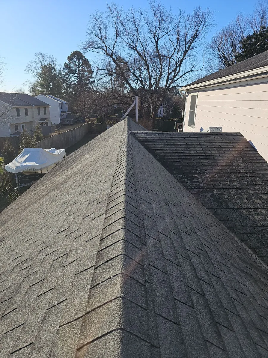 Ridge line of the original roof with weathered shingles in Purcellville, VA