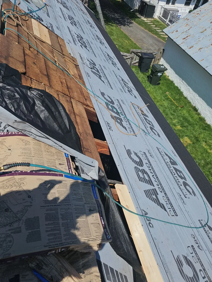 Tear-off and new underlayment underway on a roof in Purcellville, VA