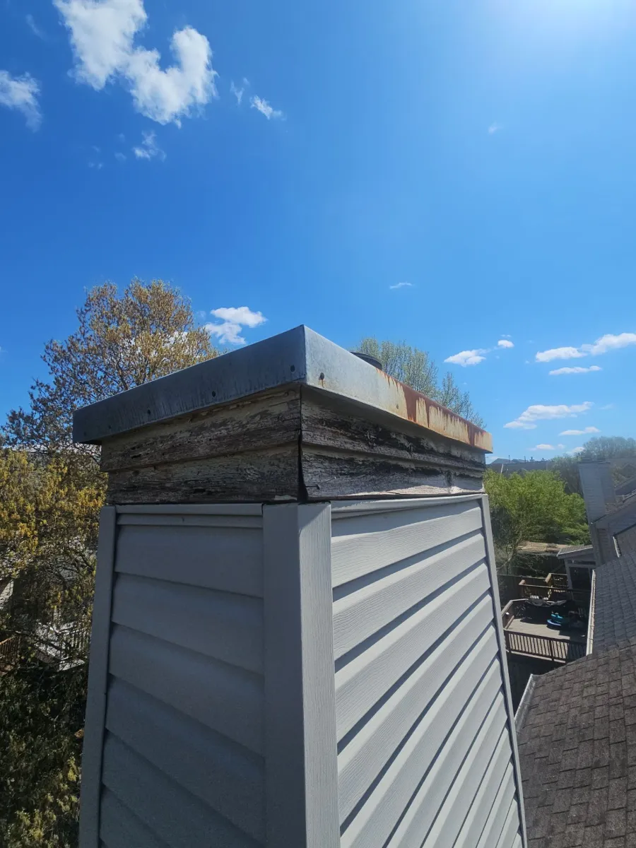 Chimney top without a proper cap before the roof replacement in Sterling, VA